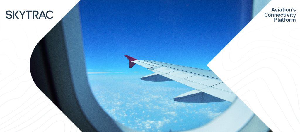 The wing of an airplane as seen through the cabin window