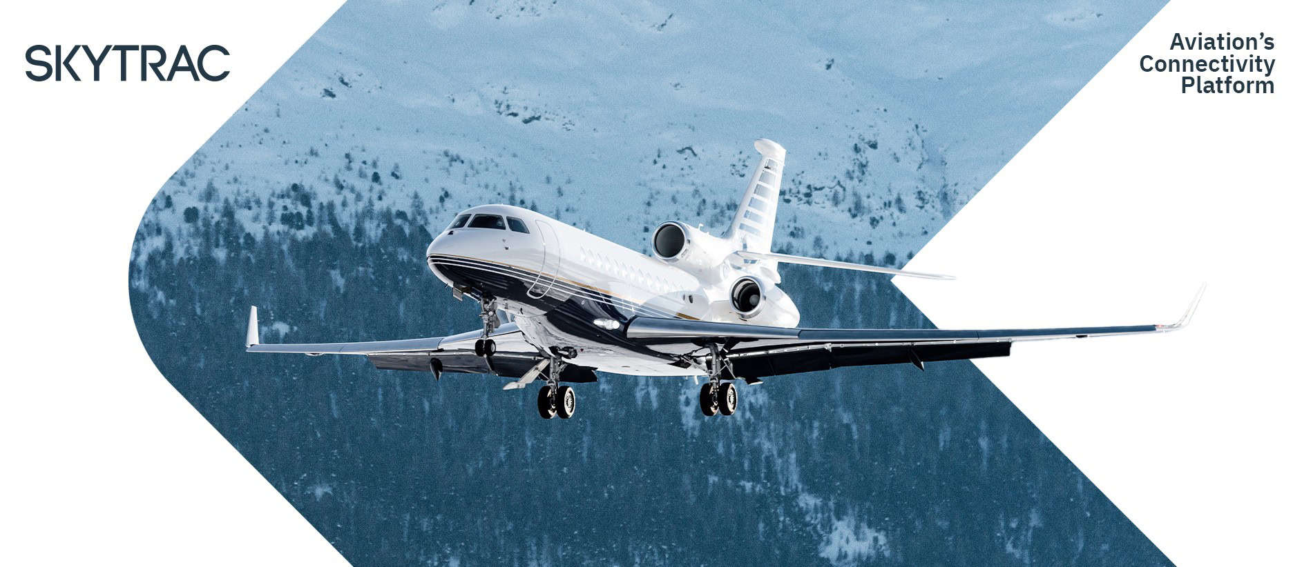 White business jet flying near snowy mountains